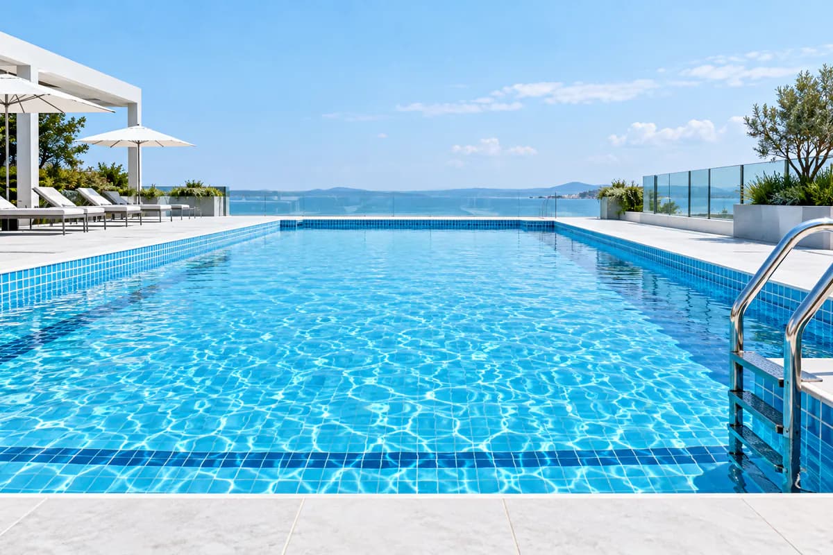 Clean blue swimming pool maintained with professional treatment chemicals
